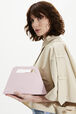 Trapeze vinyl bag Baby pink front worn view
