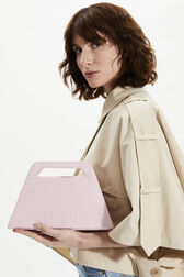 Trapeze vinyl bag Baby pink front worn view