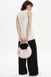 Domino medium vinyl bag Baby pink front worn view