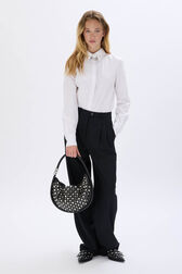 Medium Domino bag in leather and studs Black front worn view