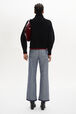 Turtleneck Jumper With Curved Long Sleeves Black back worn view