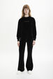 Women Velvet Flare Pants Black front worn view
