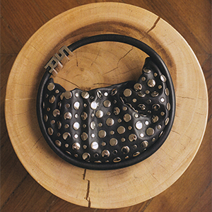 Women holding a designer handbag - Black