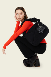 Women - Camera Demi-Pull medium knit bag, Black front worn view